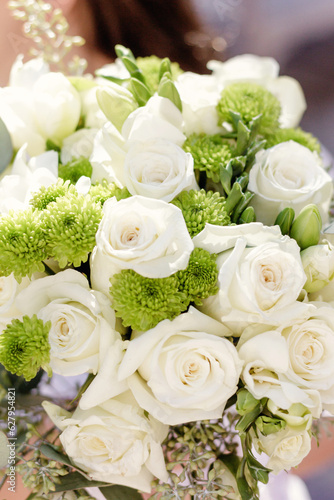 Close up of white rose wedding bouquet