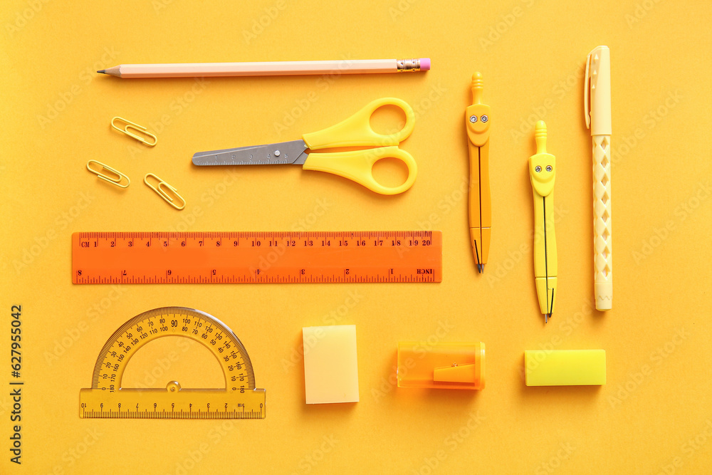 Different school stationery on orange background Different school stationery on orange background