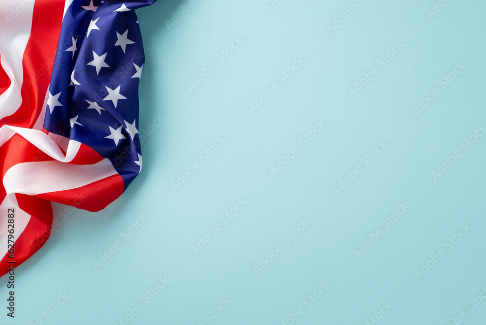Highlight the contributions of female laborers on Labor Day. Top view of USA flag on blue backdrop with empty space for text Highlight the contributions of female laborers on Labor Day. Top view of USA flag on blue backdrop with empty space for text