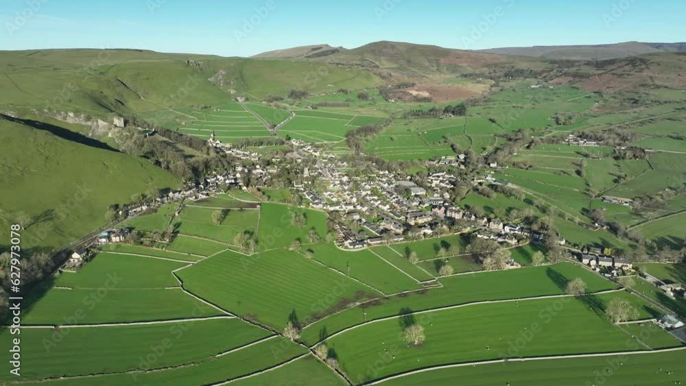 Wide aerial point of interest shot focusing on the centre of Castleton ...