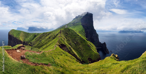 Fototapeta Naklejka Na Ścianę i Meble -  Kallur lighthouse on green hills of Kalsoy island, Faroe islands, Denmark. Landscape photography