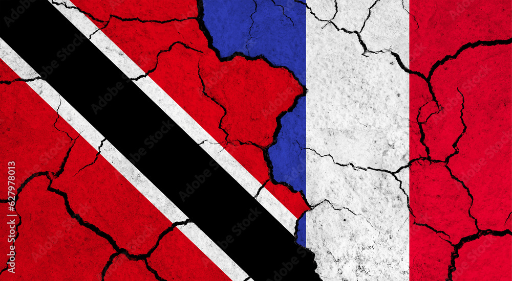 Flags of Trinidad and France on cracked surface - politics, relationship concept
