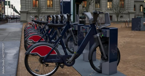 Row of Green bicycles for rent. Electric bicycle charging station. Shared electric bikes parked on city street early in the morning