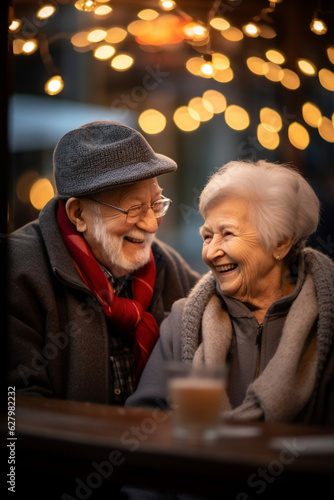 Happy older couple in a cozy place smiling laughing  warm autumn mood