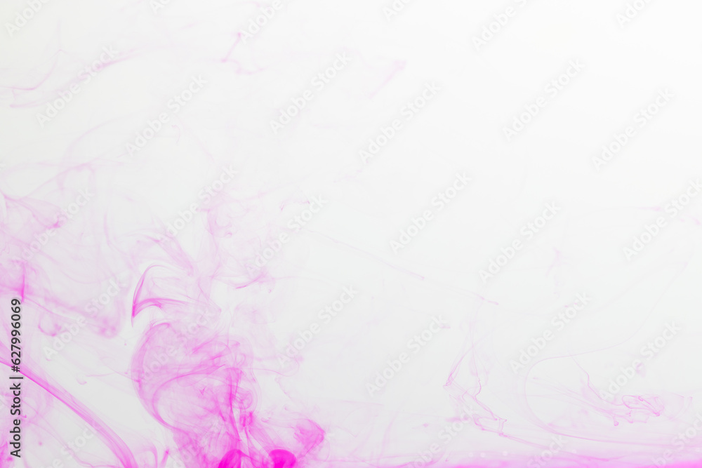 Obraz premium Close up of pink ink in water with copy space on white background