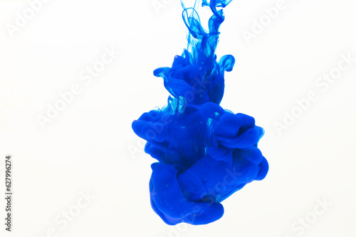Close up of blue ink in water with copy space on white background