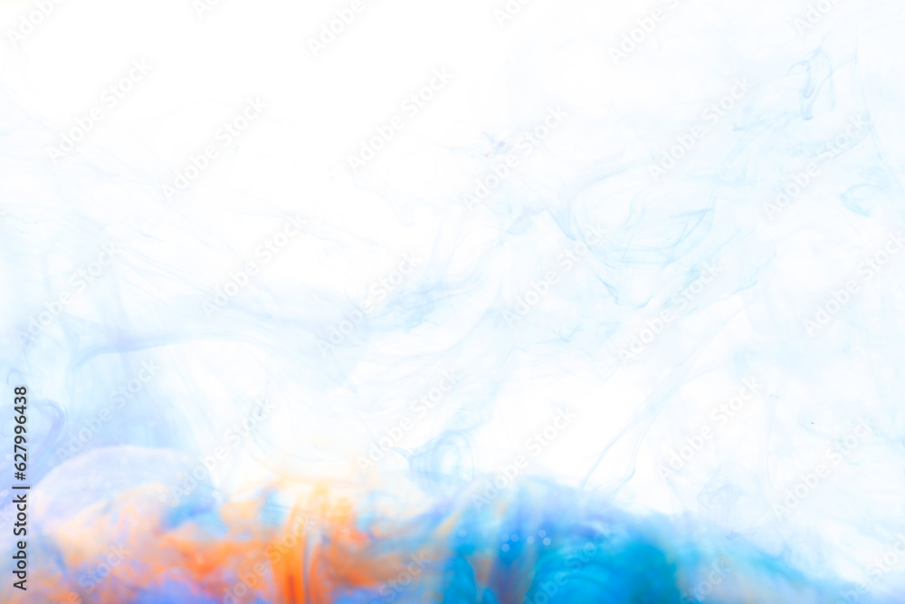 Close up of orange and blue ink in water with copy space on white background
