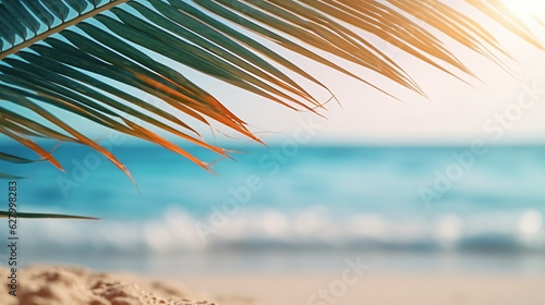 Golden sand at tropical beach. Beautiful background for summer vacation and travel. blurry palm leaves and sea on sunny day © Argun Stock Photos