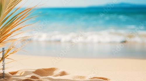 Golden sand at tropical beach. Beautiful background for summer vacation and travel. blurry palm leaves and sea on sunny day © Argun Stock Photos