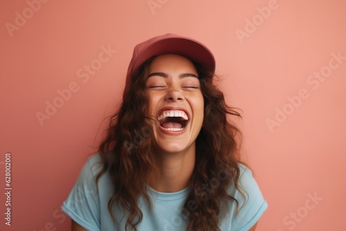 portrait of young happy smiling woman wearing hat