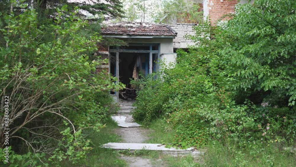 Slow motion entrance to an abandoned building 4k slow motion Slow motion entrance to an abandoned building 4k slow motion