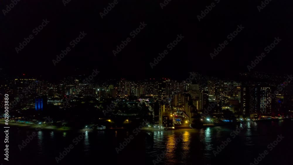 Distant aerial view of Honolulu Hawaiii and Waikiki at night. 4k drone. Distant aerial view of Honolulu Hawaiii and Waikiki at night. 4k drone.