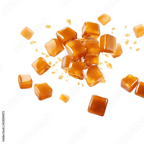 Flying caramel cubes isolated on white background.