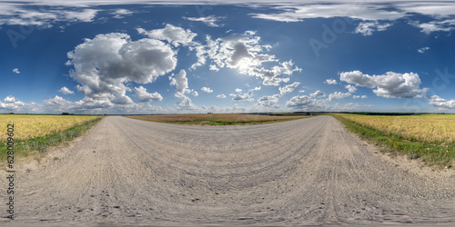 360 hdri panorama on white sand gravel road with clouds on blue sky in equirectangular spherical seamless projection, skydome replacement in drone panoramas and game development or VR content