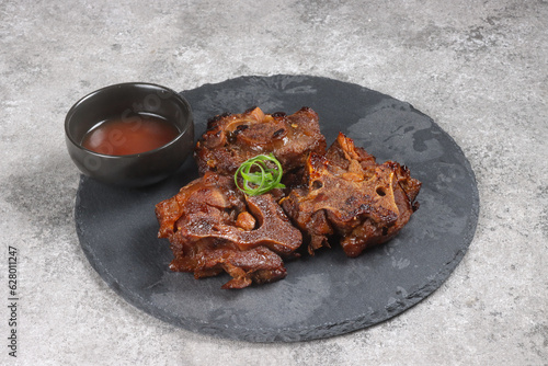 Buntut Sapi Bakar or Roasted Oxtail or Grilled Oxtail. photo