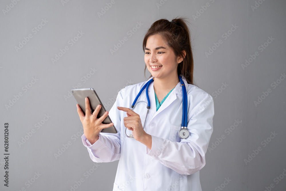 Female Young Asian doctor making video call with patient by smartphone cell phone laptop tablet Female Young Asian doctor making video call with patient by smartphone cell phone laptop tablet