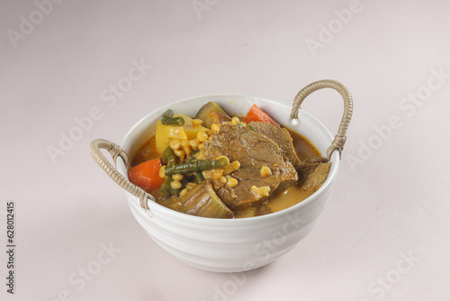 Dalca Daging or Beef Dalca is a Stewed Beef Curry with Lentils and Vegetables, Famously Served with Briyani or Tomato Rice. photo