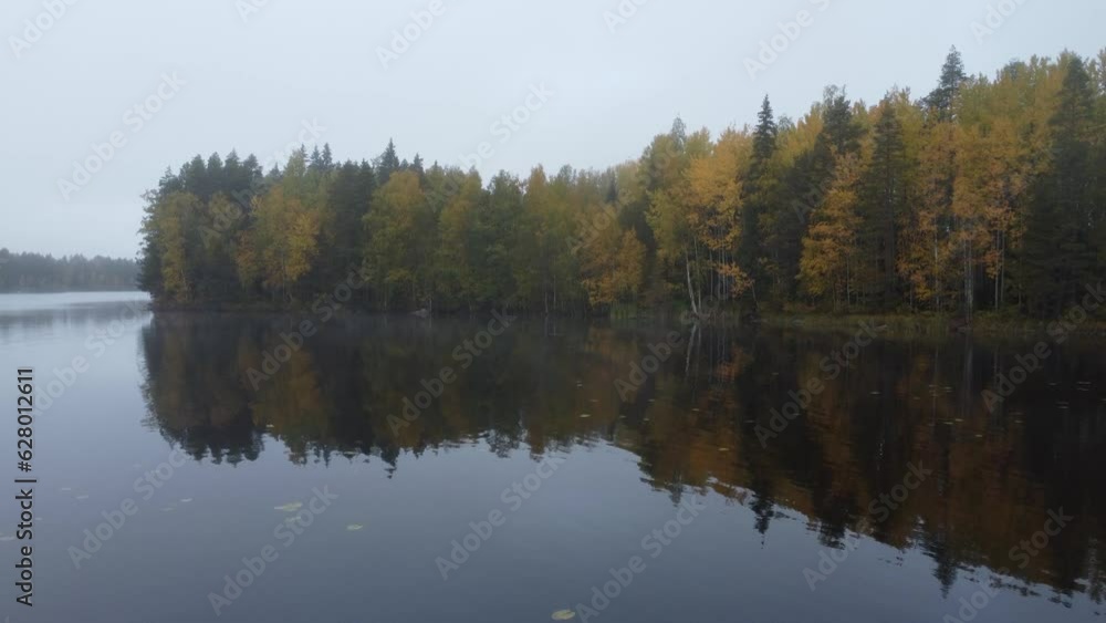 Flying over lake Pukala, Finland towards an island with autumn color trees Flying over lake Pukala, Finland towards an island with autumn color trees