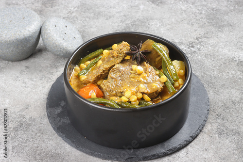 Dalca Daging or Beef Dalca is a Stewed Beef Curry with Lentils and Vegetables, Famously Served with Briyani or Tomato Rice. photo