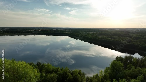 Aeria view of Osadnik Gajówka artificial lake (waste pond) in Gmina Przykona, within Turek County, Voivodeship, Poland photo