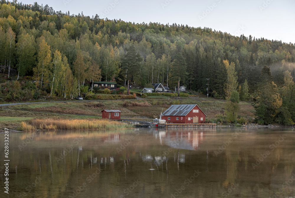 Obraz premium Swedish houses and mountain ant the sea at skuleberget campsite caravan camping in Hoga Kusten Sweden
