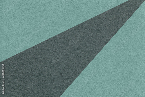 Texture of old craft dark cyan and teal color paper background, macro. Structure of vintage abstract cardboard