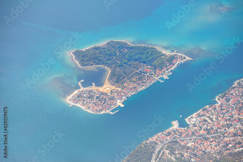 Krapanj island in the Adriatic Sea in Croatia . Flying over the island photo