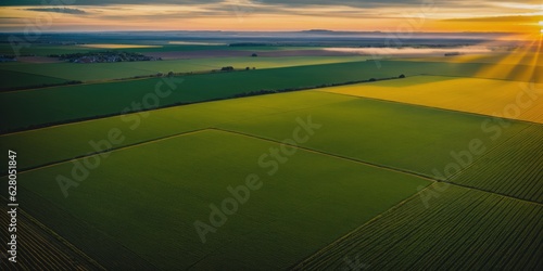 aerial landscape with big crop fields close to sunset