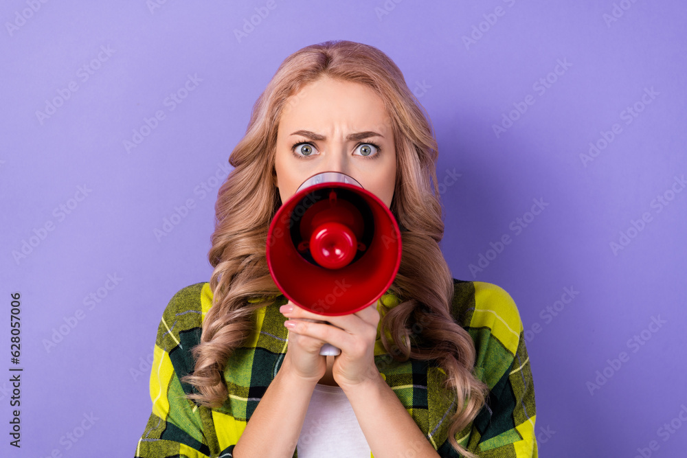 Obraz premium Photo of unsatisfied mad young girl hands hold loudspeaker communicate say tell isolated on violet color background