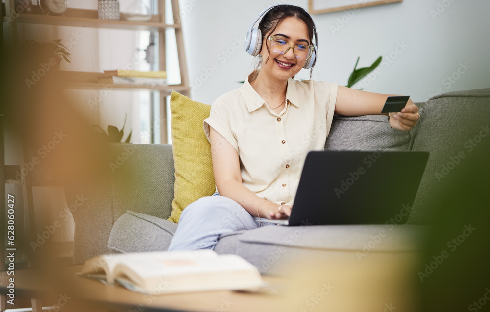 Happy woman, credit card and laptop with headphones in home for ecommerce sales, fintech password and online shopping. Female customer, computer banking and code to upgrade music subscription account Happy woman, credit card and laptop with headphones in home for ecommerce sales, fintech password and online shopping. Female customer, computer banking and code to upgrade music subscription account