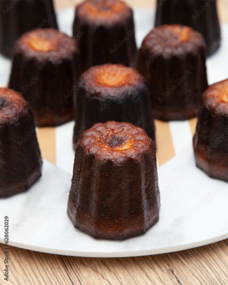 Canele, a small french pastry flavored with rum and vanilla Canele, a small french pastry flavored with rum and vanilla