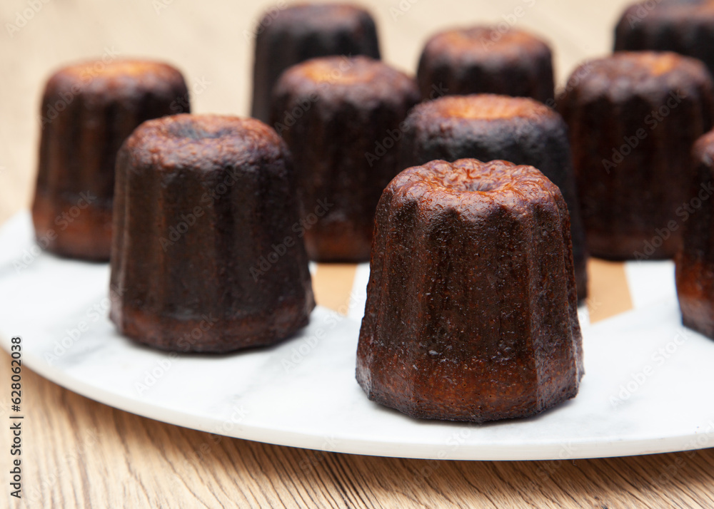 Canele, a small french pastry flavored with rum and vanilla Canele, a small french pastry flavored with rum and vanilla