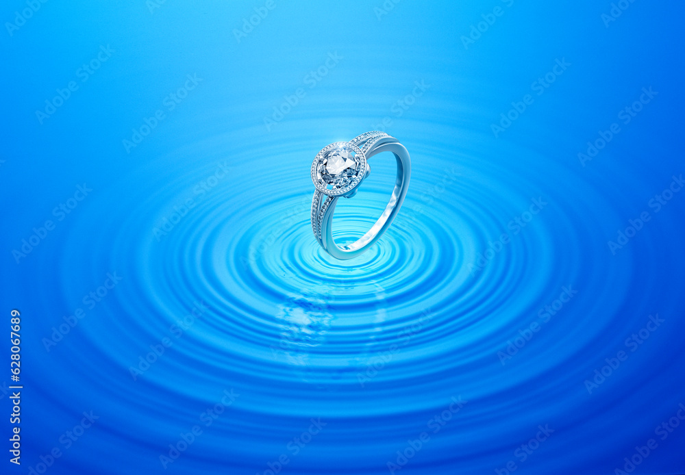 Diamond ring on rippled water with reflection