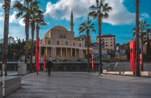 Durres, Albania - November 15 2022: fountains on the main square (Sheshi Liria) in Durres, Albania, the city hall, Great Mosque of Durres photo