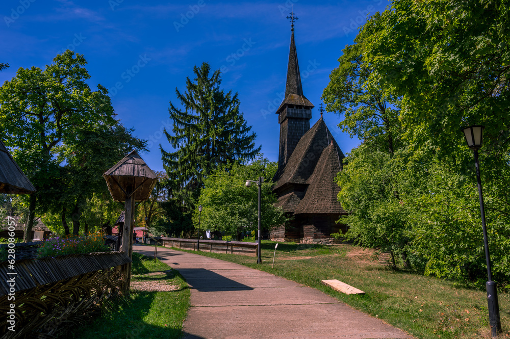 The Dragomiresti wooden church in village museum in the Dimitrie Gusti National Village Museum in Herastrau Park, Bucharest, Romania. The Dragomiresti wooden church in village museum in the Dimitrie Gusti National Village Museum in Herastrau Park, Bucharest, Romania.