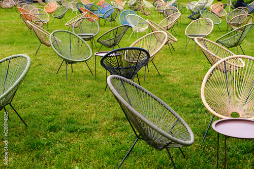 cain chairs in green grass lawn background photo