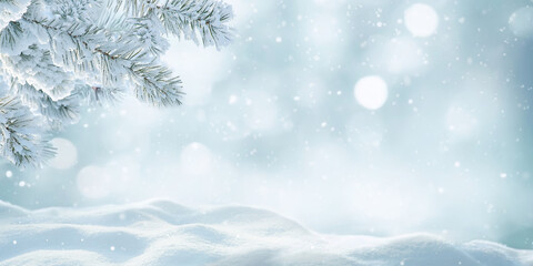 Beautiful winter background image of frosted spruce branches and small drifts of pure snow with bokeh Christmas lights and space for text.
