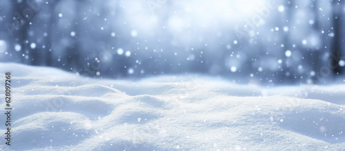 Winter snow background with snowdrifts, with beautiful light and snow flakes on the blue sky in the evening, banner format, copy space. photo