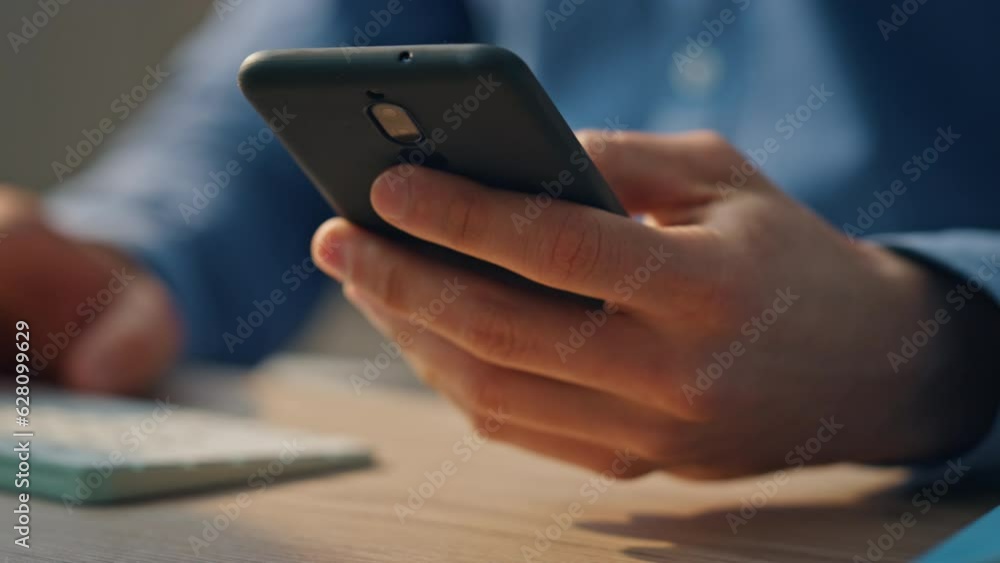Startuper hands typing keyboard at office desk closeup. Man answering phone call