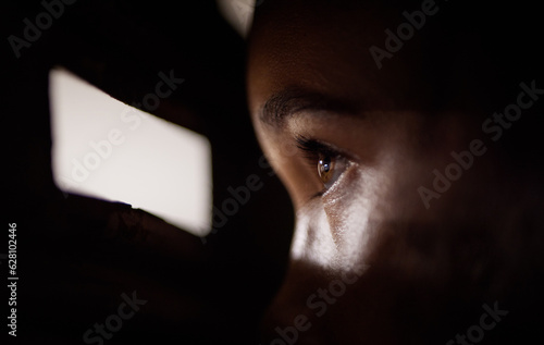 Fotografie .Peep, hole and eye to spy for security or face at the window looking in the dar