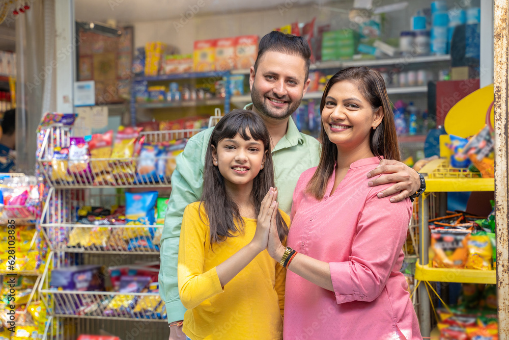 Happy Indian family at grocery shop.