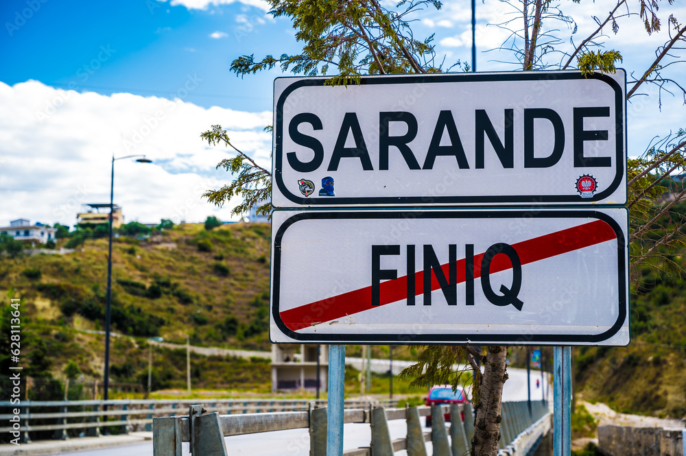 Obraz premium Sarande, Albania - September 5 2022: Sarande and Finiq road sign, highway, travelling, Albania. travel background.
