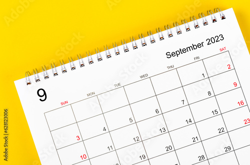 Close up the September 2023 Monthly desk calendar for 2023 year on yellow background.