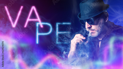 Man smokes vape. Vaper in h...
