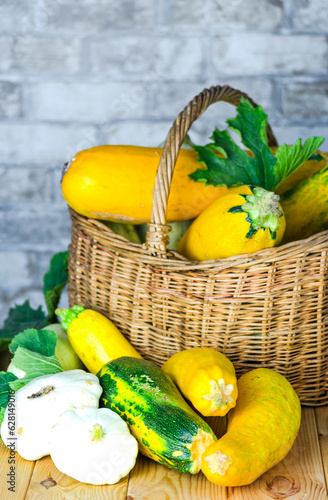 fresh zucchini and squash in a wicker basket
