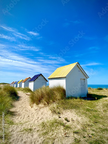 colored beach huts at the beach