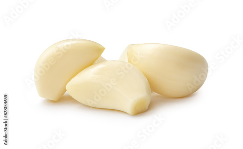 Peeled garlic cloves in stack isolated on white background with clipping path