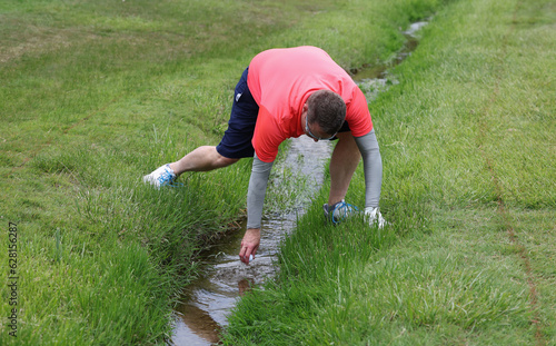 golf ball in creek photo