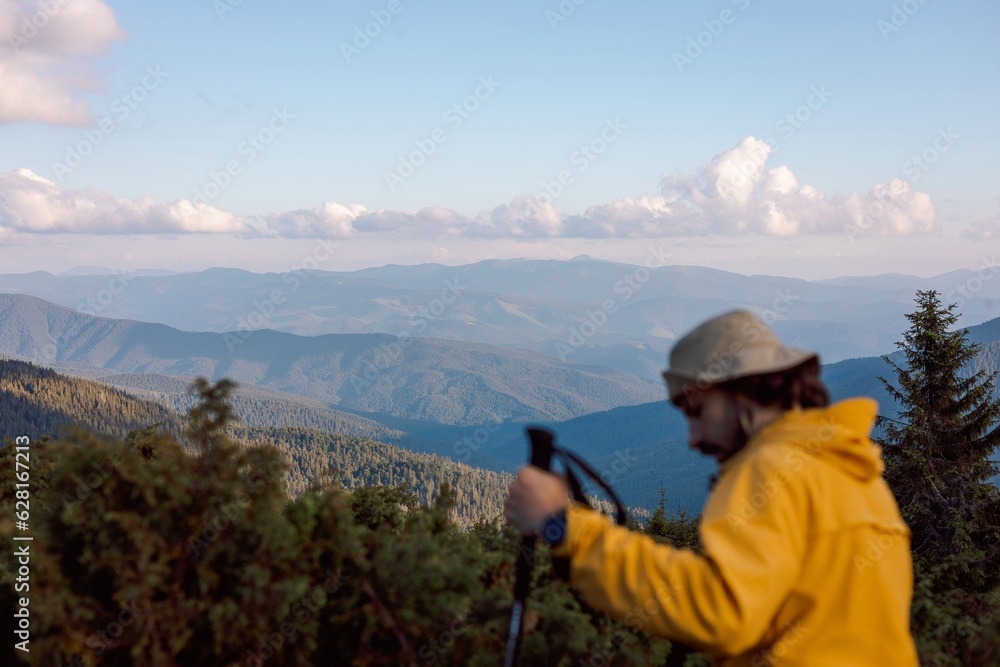 blurred silhouette of a traveler on the background of evening mountain landscapes blurred silhouette of a traveler on the background of evening mountain landscapes