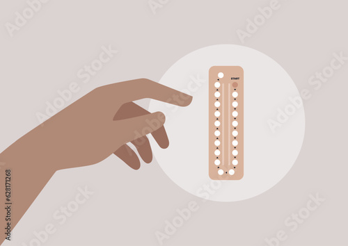The process of pregnancy planning depicted by a hand reaching for a pack of birth control pills